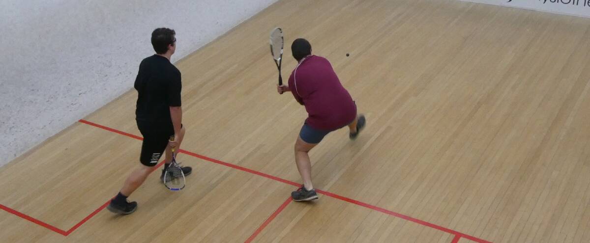 ACTIVE: John Gown about to play a backhand shot with Brodie Lashbrook watching on. Photo: Supplied