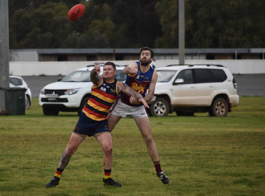 HARD-FOUGHT: Leeton-Whitton's Jade Hodge and GGGM's Josh Walsh battle for the ball during the Crows' last home game a fortnight ago. Photo: Liam Warren 