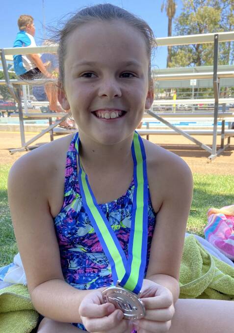 FUN IN THE POOL: Leeton's Charlotte Mallamace picked up a silver medal in the 10 years girls 100-metres backstroke during the recent carnival. Photo: Contributed 