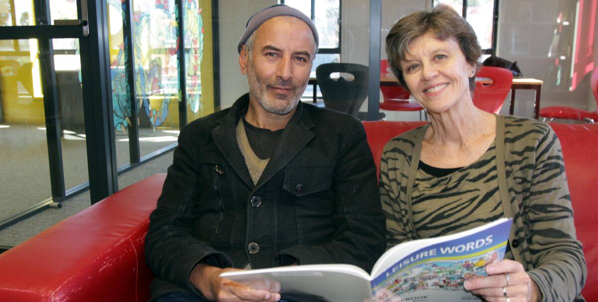 HOME: Sayed Ibrahim Shah Mosawi (left) came to Australia as a refugee and is now a permanent resident. Leeton's Robyn Hutchinson (right) has been helping him learn English. Photo: Talia Pattison 