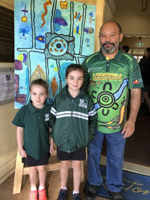 CELEBRATE: Whitton-Murrami Public School students Asha and India Morriss with William Ingram who assisted the school with their artwork. Photo: Talia Pattison 