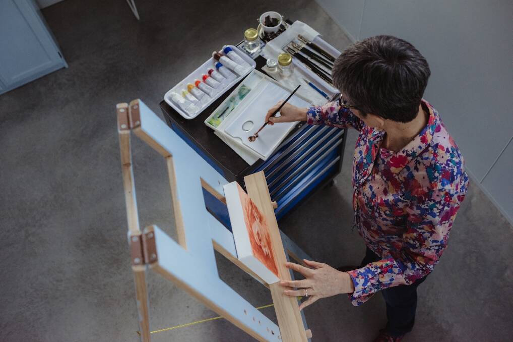 CREATE: Leeton shire artist Dorothy Roddy creates one of her pieces in her studio. Residents will also have a chance to watch her work during the exhibition. Photo: b.art.on