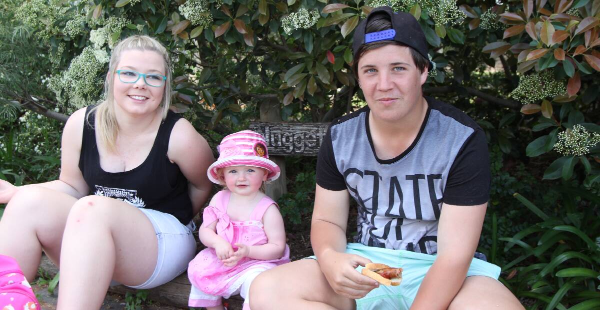 ENJOY: Breeanna Scott 15, Lila Phillips 18 months and Dallas Pearce, 15, take a break from the centenary celebrations. 