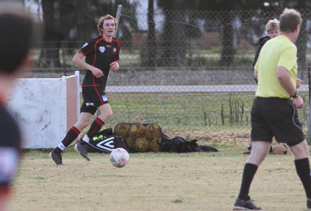 SEARCH: Leeton United's Chris Newman looks for options during his side's most recent home game. Photo: Talia Pattison