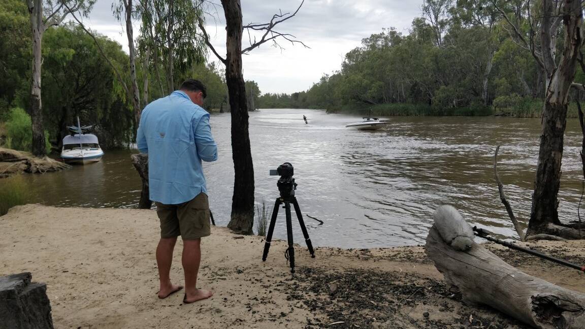 ON LOCATION: The crew films some footage at the Murrumbidgee River. Photo: Ken Dachi