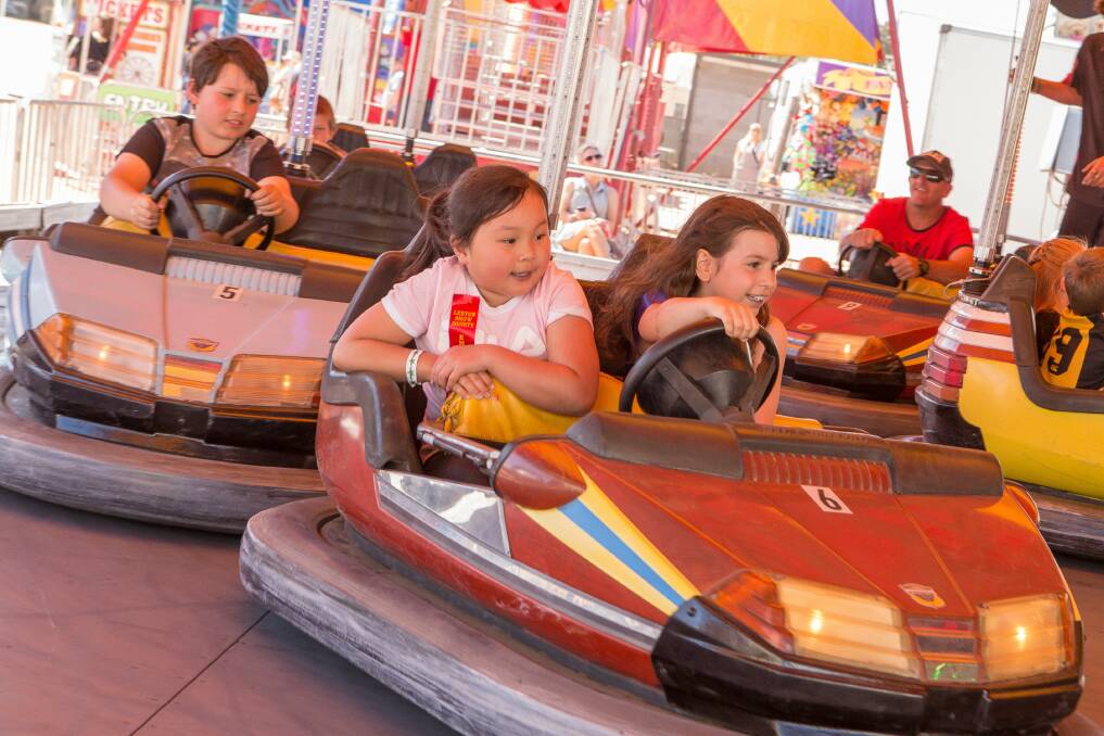 FUN: Milli Su and Genevieve Bruno enjoying the dodgem cars with Oliver Bruno hot on their tail. Photo: Leah Shelton