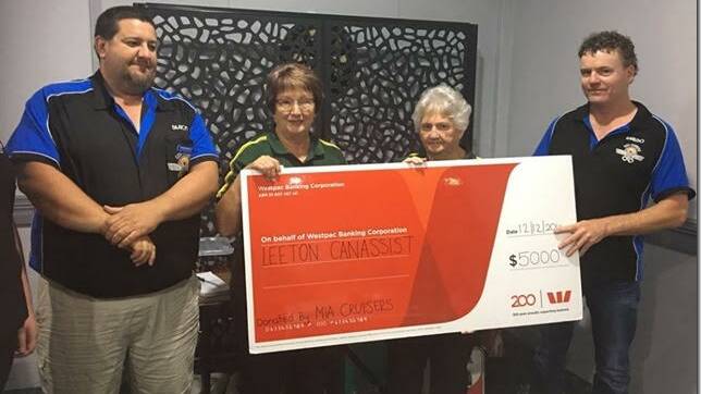 CHRISTMAS CARE: MIA Cruisers presiden Damian Black (left) and vice president David Warburton present the $5000 cheque to Leeton Can Assist members Dot Rogers and Judy McLean. 