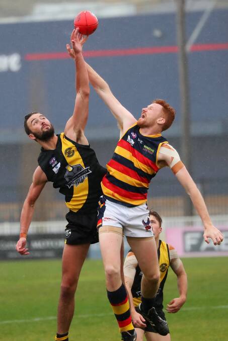 TOUGH CONDITIONS: Leeton-Whitton's Mason Dryburgh tries to win possession for his team. Photo: The Daily Advertiser 