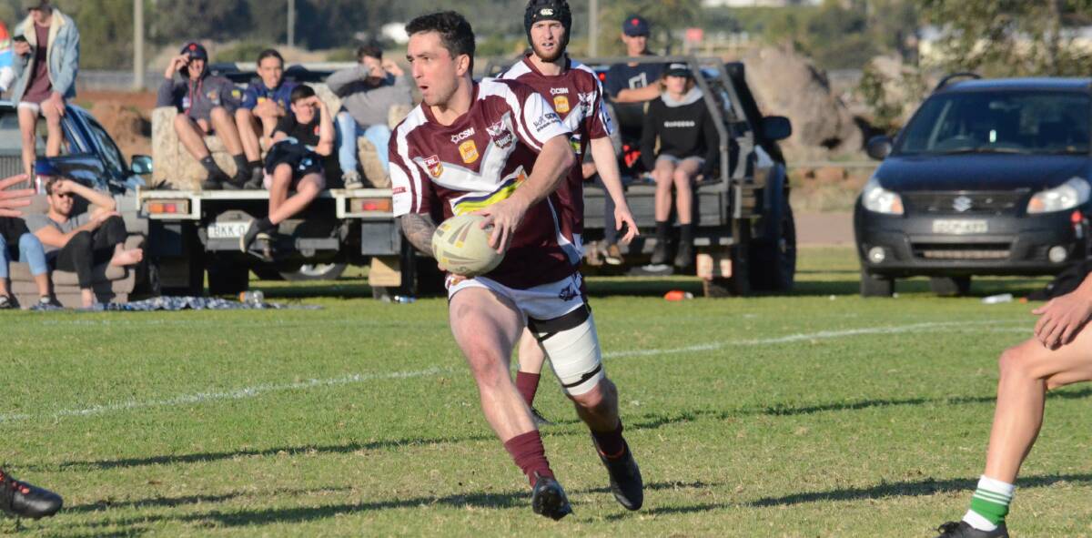 WEIGHING UP: Yanco-Wamoon's Daniel Johnson assesses where he should send this pass during a recent match on the Hawks home turf. 