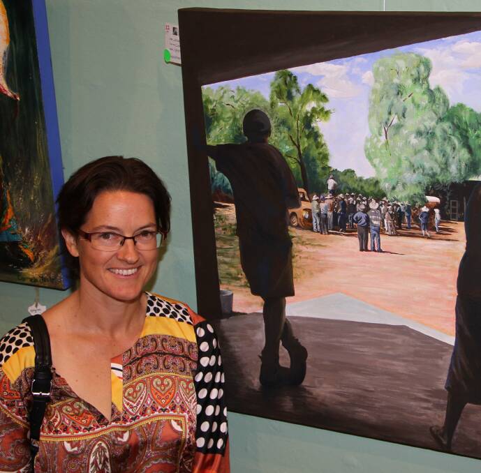 ARTISTIC: Jacqui Herrmanni n front of her piece "Clearance Sale" at last year's Penny Paniz Memorial Art Exhibition. 