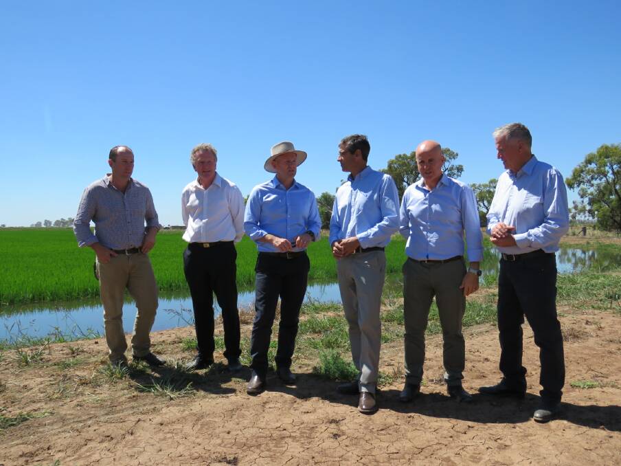 Nuffield Scholar/rice farmer Drew Braithwaite, NSW Rice Marketing Board deputy chairman and SunRice director Noel Graham, Minister for Primary Industries Niall Blair, RGA president Jeremy Morton, Member for Murray Adrian Piccoli and SunRice chairman Laurie Arthur discuss the continued arrangement.