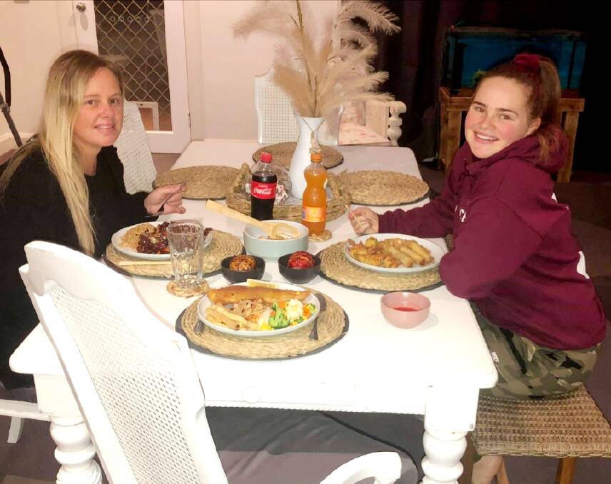 SUPORTING LOCAL: Sarah Cleathero (left) and her daughter Kaila DePaoli, 17, enjoy a meal from Tangs recently. Photo: Phill McPhee