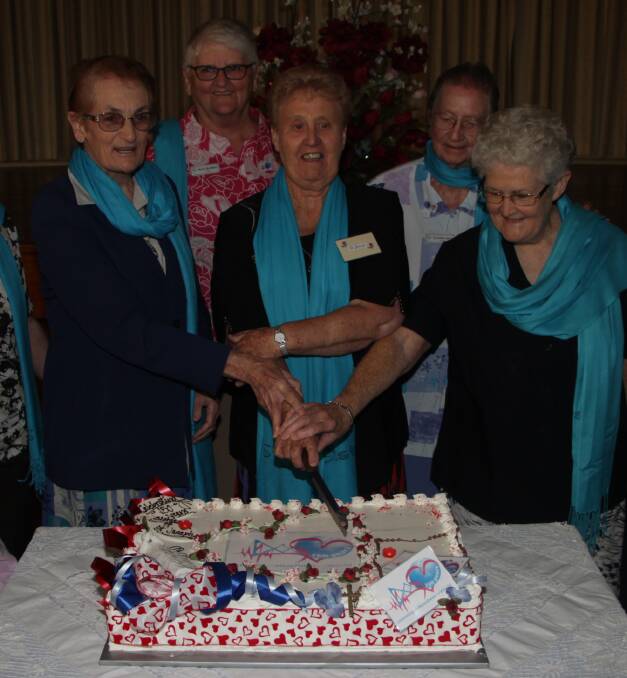TIME TO CELEBRATE: Sister Michelle Condon, Sister Janet Glass, Sister Mary O'Day, 
Marie McAlister and Sister Gerardine Agnew cut the cake. Photo: Ron Arel 




