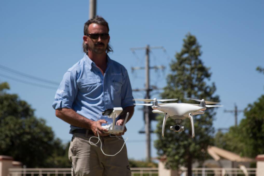 Leeton Shire council's Kai Attree skillfully pilots council's drone to aid in surveying shire properties and inspecting buildings. Photo: Ron Arel