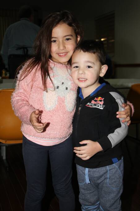 CUDDLES OF FUN: Montana, 5, and Jamie Nardi, 3, enjoy a cuddle on the dance floor at Madonna Place. Photo: Ron Arel