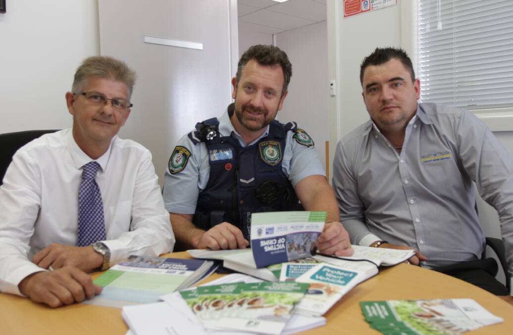 THE TIME HAS COME: Graham Heffer, Marc Roberts and John Washington discuss the reformation of a Neighbourhood Watch group for Leeton. Picture: John Gray