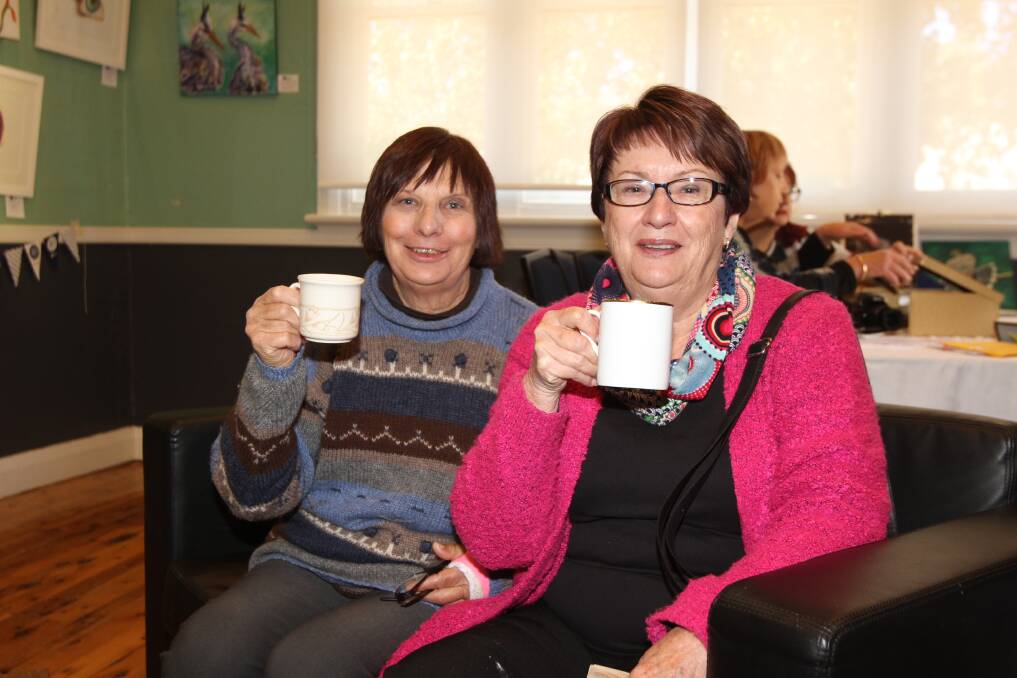 TEA TIME: Barb Mansell and Dot Rogers sit back and raise a toast at the Biggest Morning Tea at the Multipurpose Centre in Leeton. Photo: Ron Arel