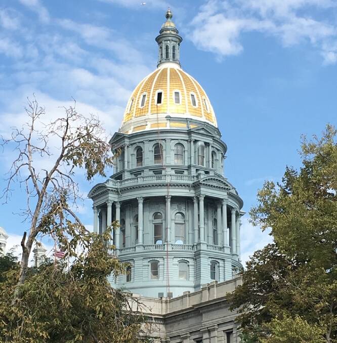 The gorgeous gold dome of the Colorado State Capitol building in Denver
