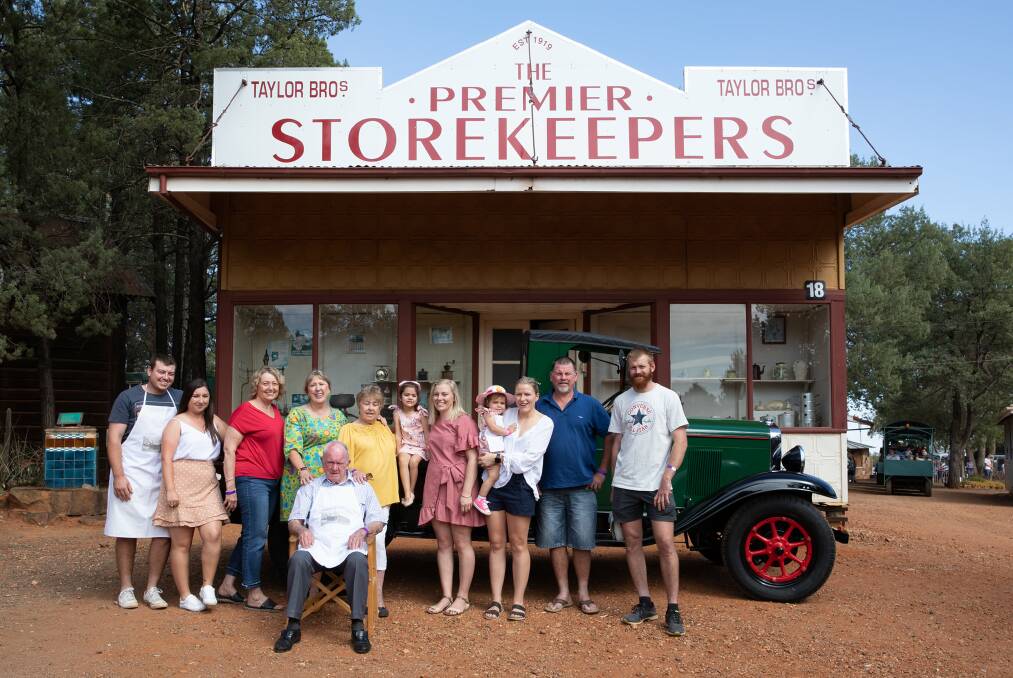 LOVED: David Alan Taylor (seated) with his family outside the replica of the Taylor Bros grocery at Pioneer Park Museum. Photo: Supplied