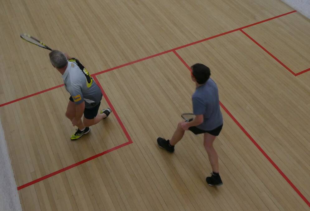 WAITING: Dion DeMamiel (right) prepares to retrieve a backhand shot played by David Cross in Leeton squash. Picture: Supplied