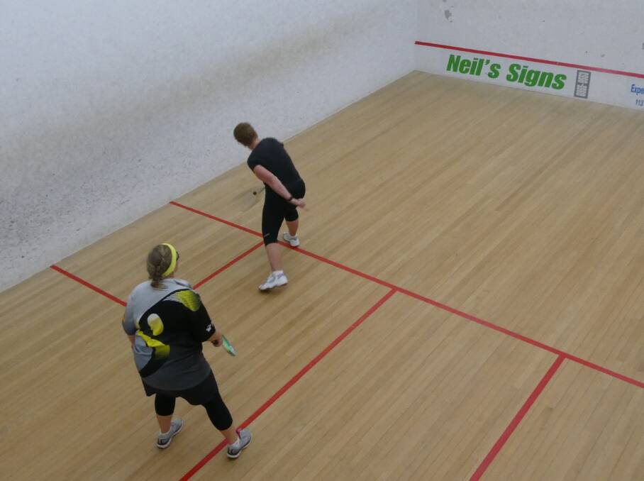 IN ACTION: Carol Davidson plays the ball as Kira Brettschneider prepares to react during round three of Leeton Squash Club's summer competition. Picture: SUPPLIED