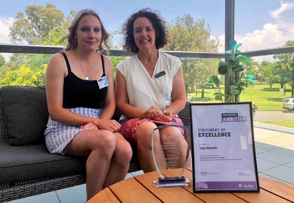 SUCCESS: Tara Martin (left) with her cookery teacher Fiona Bance at the 2018 TAFE Wagga graduations. Picture: Toby Vue