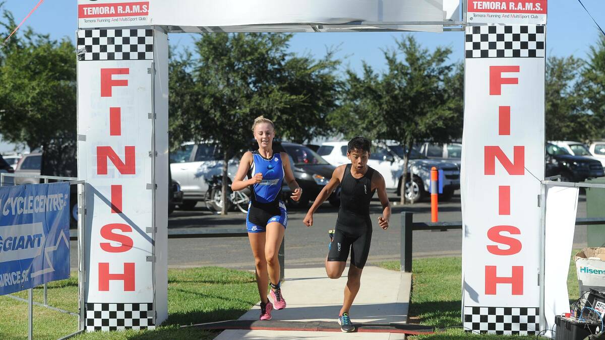 FINAL FLURRY: Molly Evans and Lou Ervine cross the finish line in 2018. 