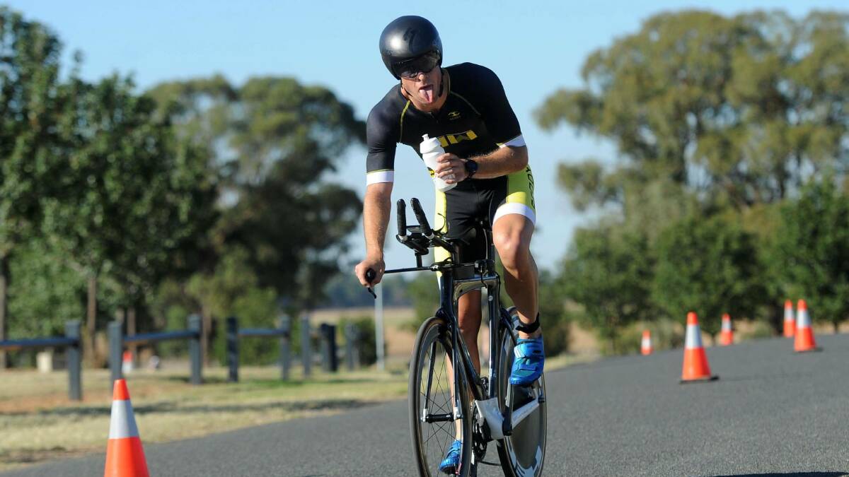 EFFORT FACES: Gerard Wild makes the most of his photo opp enroute to a record-breaking time at the 2018 Temora Triathlon.