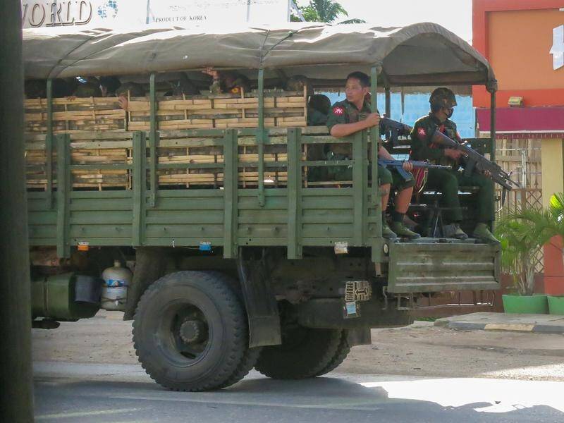 Military troops and police patrol in Myanmar.