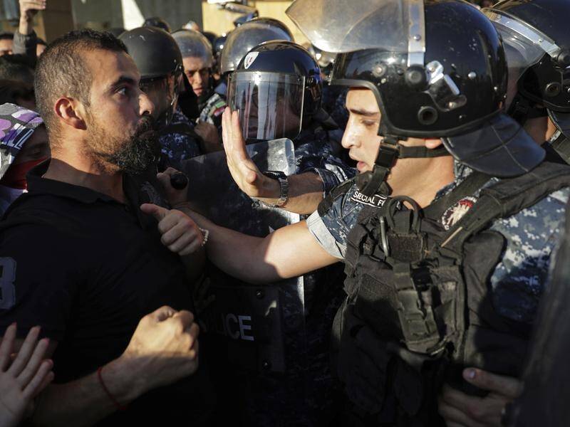 Lebanon's parliament has been forced to postpone a sitting after violent protests erupted again.
