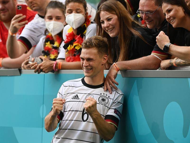 Germany's Joshua Kimmich celebrates with his family after their Euro triumph over Portugal