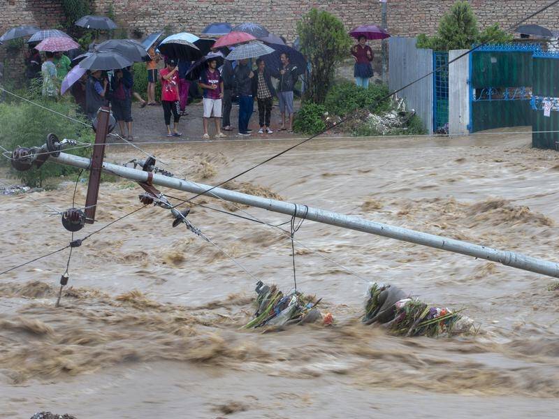 At least 47 people have been killed in floods and landslides triggered by heavy rain in Nepal.
