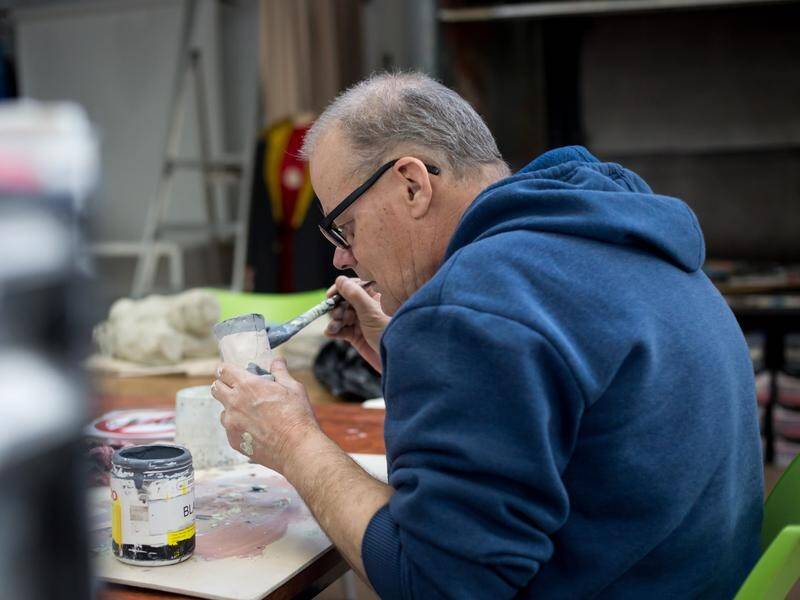 An artist at work in the Arts Project Australia studio in Northcote, Melbourne. (HANDOUT/ARTS PROJECT AUSTRALIA)