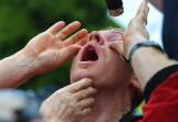 A pepper-sprayed protester at an anti-lockdown protest in Melbourne in October 2020. (James Ross/AAP PHOTOS)