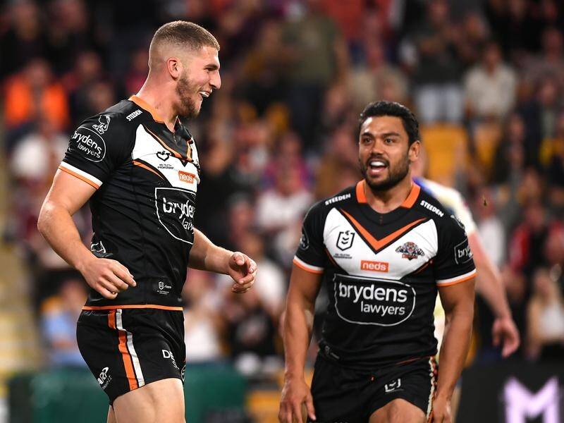 Shifted to centre, Adam Doueihi (l) scored two tries in Wests Tigers' NRL win over Newcastle.