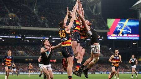 It's always a hard-fought battle when the Crows and the Power go head-to-head in the AFL Showdown. (Matt Turner/AAP PHOTOS)
