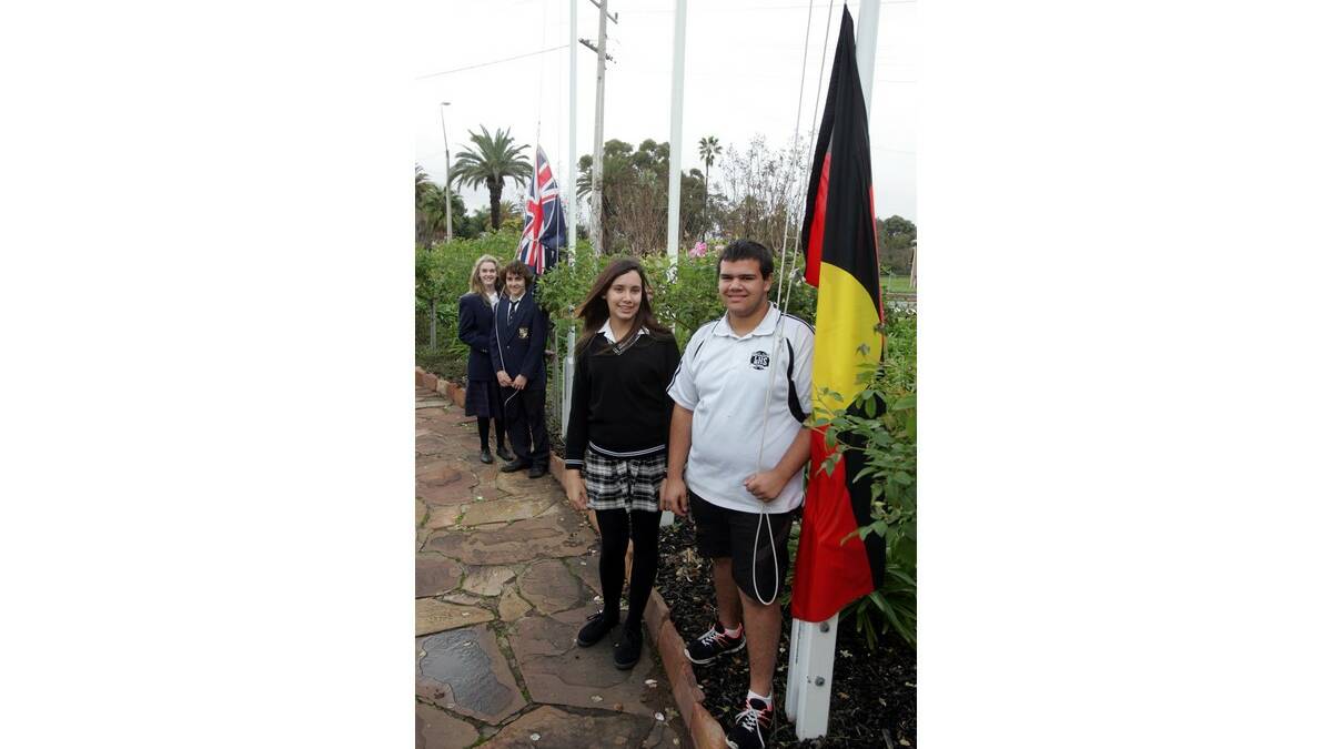 NAIDOC Week celebrations on Wednesday included a flag raising ceremony, which was conducted by (back) St Francis College students Megan Dunn and Sebastian Eldridge and Leeton High's Alanis Wortley and Elijah Ingram.