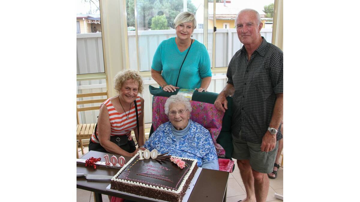FLORENCE Gladman celebrates her 100th birthday with (from left) Maree Osmond and Robin and Colin Grant.