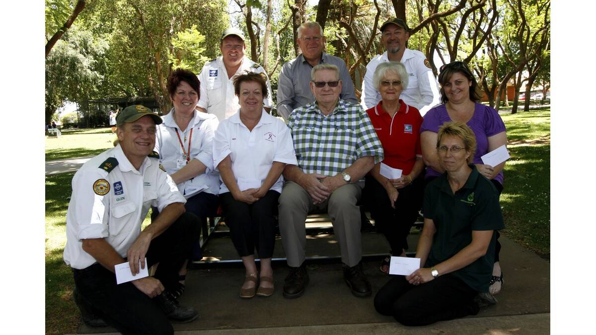 LEETON Country Roundup organisers David Boots (front centre) and Rocky Sillis (behind) present donations to (front from left) Glen Hehir (Leeton Rescue Squad), Jane Mackay (Gralee P&C), (middle) Penny Walker (Carramar/Leeton Hospital Auxiliary/Friends of Pastoral Care), Sue Brett (Leeton Breast Cancer Support Group), Yvonne Murphy (Country Hope), Tanya Lewis (Meals on Wheels), and (back) Glenn Newman and Jason Fields (Leeton Rescue Squad).
