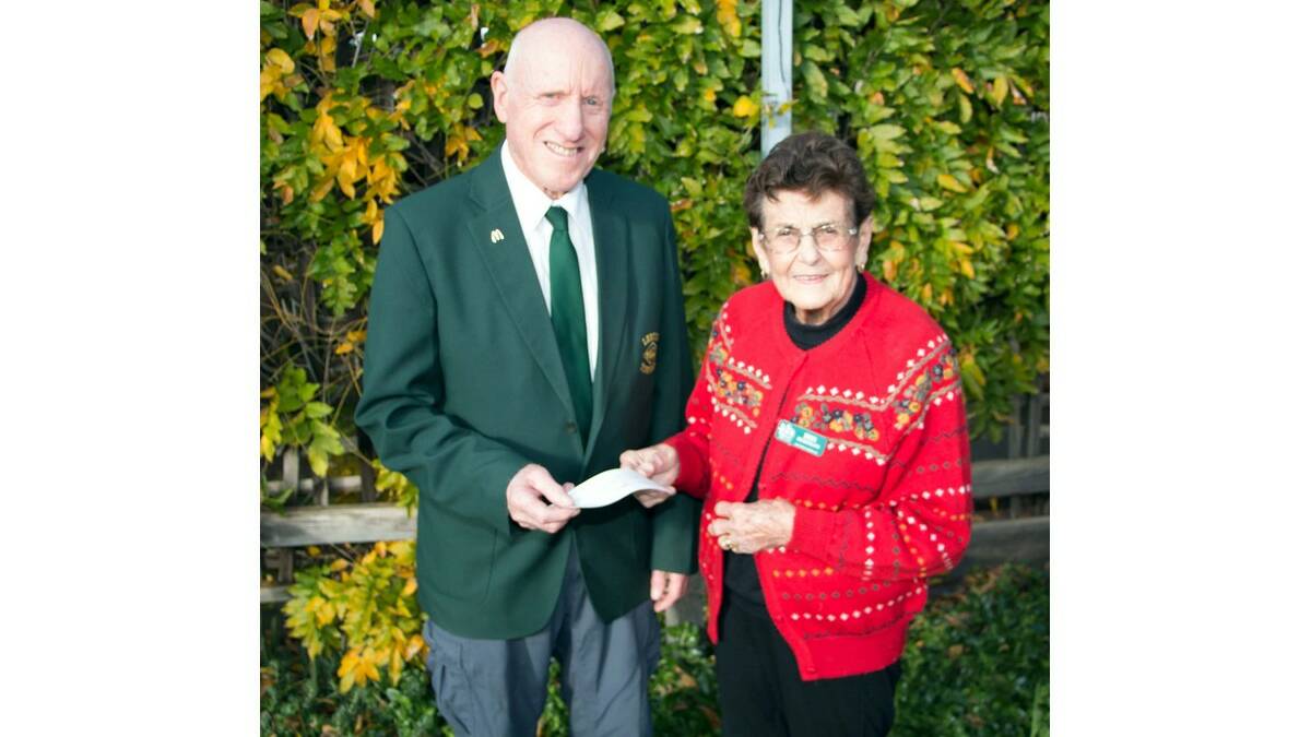 BARRY Allen from the Leeton Town Band is presented with funds from Water Wheel Garden Club president Iris Herrmann.