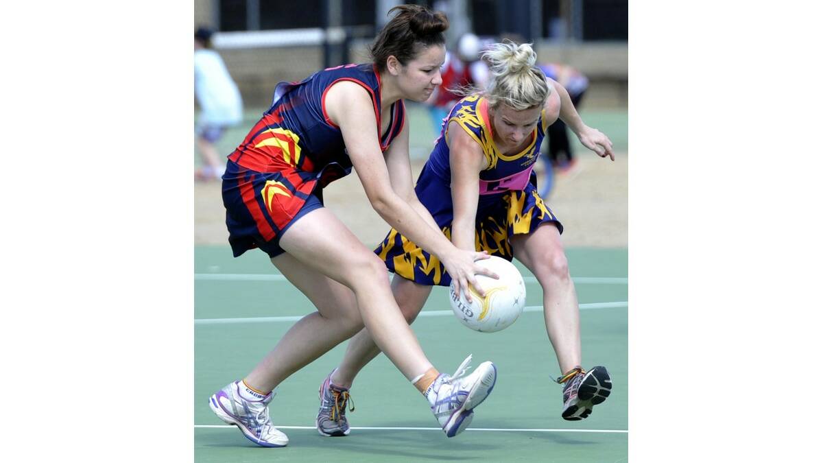 LEETON-WHITTON'S Jenna McCallum and Narrandera's Kate Bruce compete for the ball in A grade.