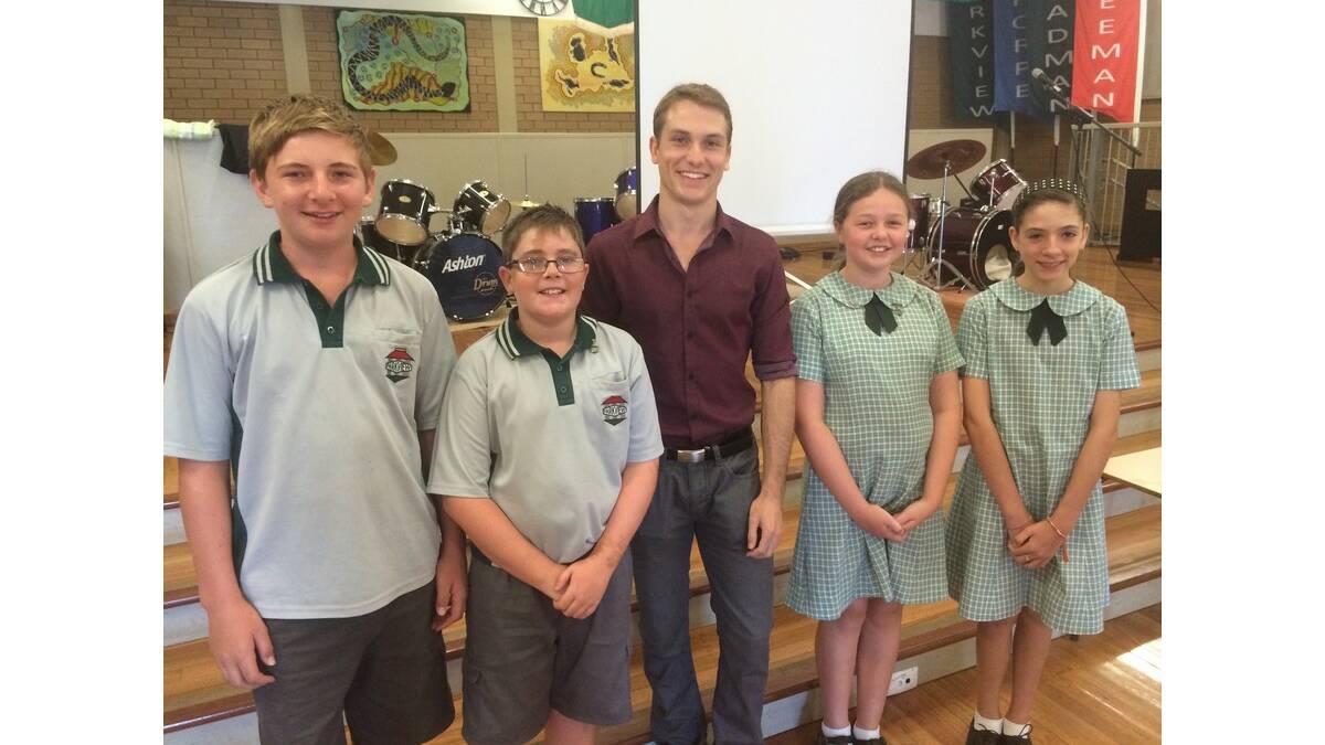 HOME and Away star and 2003 Parkview Public School captain Jake Speer (centre) catches up with current school leaders (from left) Dylan Browne, Cooper Holmes, Bree McKellar and Kate Balaz.