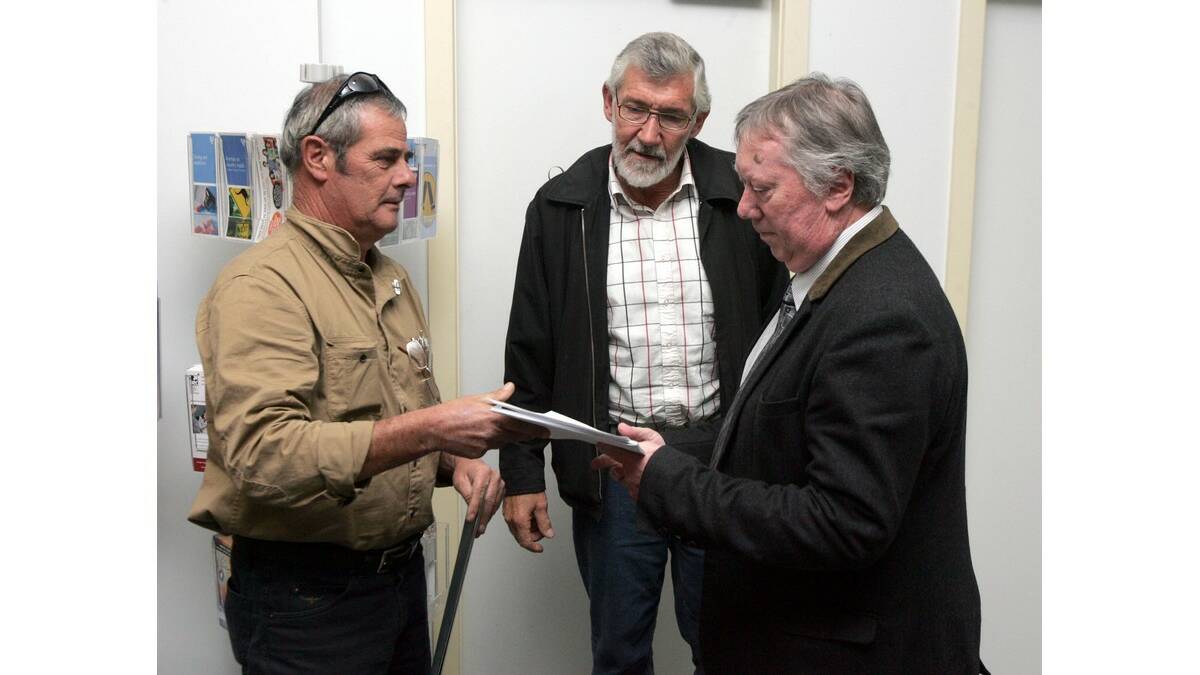 RALLY organiser Mark Norvall (left) presents the petition to mayor Paul Maytom and general manager John Batchelor.