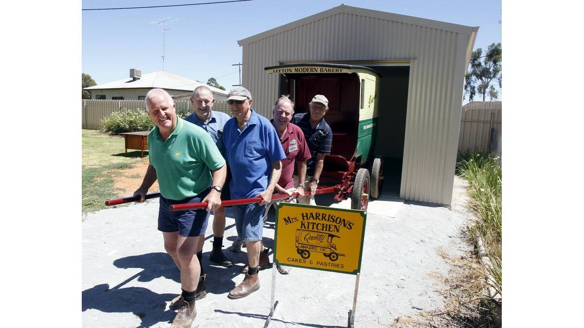 LEETON Men's Shed members (front from left) Ron Hutton, Jim Milne, David Carn, Alan Brink and Bob Bisset showcase the Mrs Harrison's Baker's cart and the new shed where it will be housed.