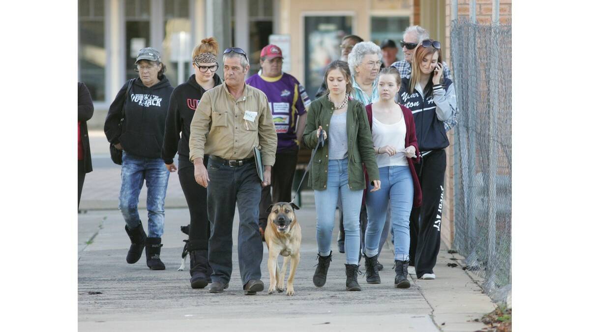 A COMMUNITY group marches to present a petition to Leeton Shire Council about treatment of companion animals by the rangers.