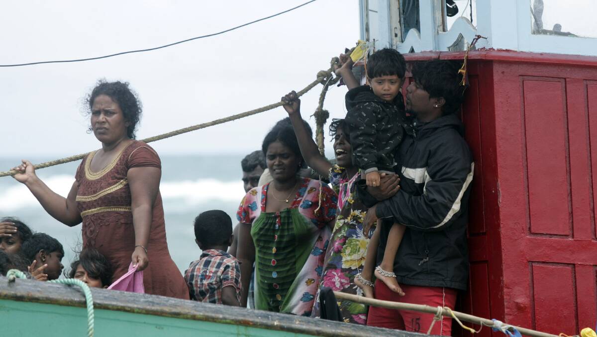 Migrants from Sri Lanka onboard a boat which washed ashore in Aceh Besar, Indonesia, in 2016. It was originally bound for Australia. Picture: Getty Images