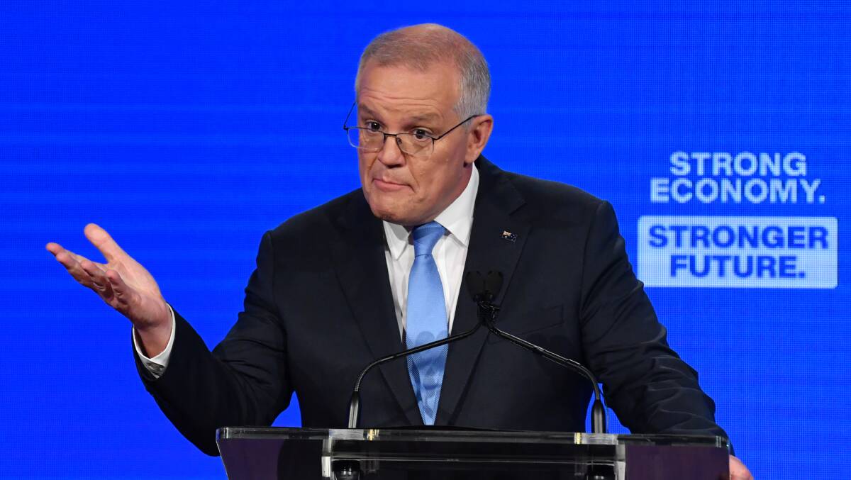 Scott Morrison found himself fighting a cost-of-living election while arguing against an inflation-matching rise in the minimum wage. Picture: AAP