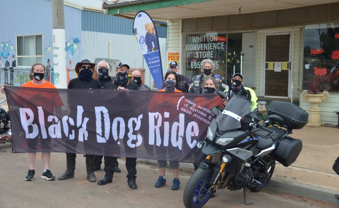 MAGNIFICENT SEVEN: Black Dog riders stop at Whitton ahead of the start of their seven rides around the Riverina. Photo: Declan Rurenga