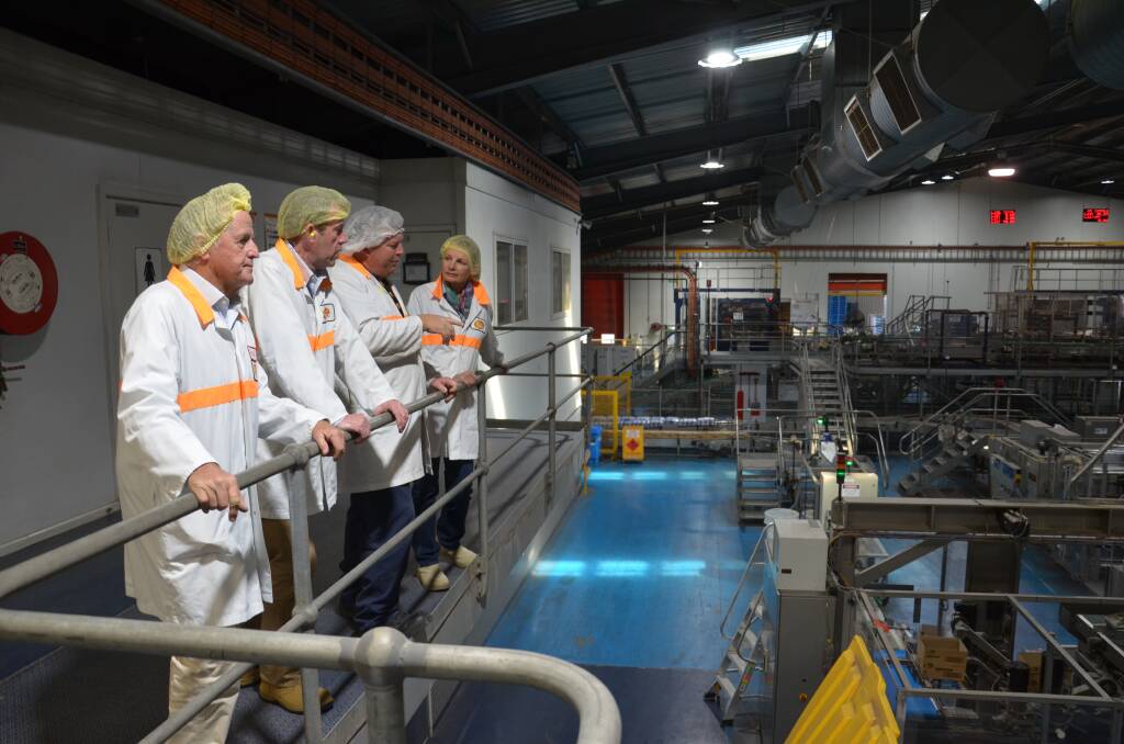 FIRST HAND: Production co-ordinator Glenn Newman (second from right) takes trade minister Dan Tehan (second from left), MP Sussan Ley (right) and SunRice chairman Laurie Arthur through the plant. PHOTO: Declan Rurenga