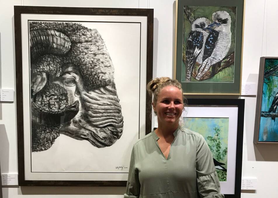 Ayla Young with her artwork 'Sir George', which won the Champion Prize in the Penny Paniz Art Competition. PHOTO: Leeton Art Society